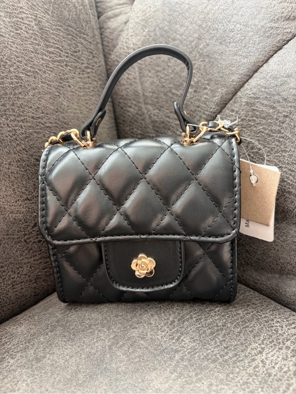 Quilted Black Top-Handle Mini Bag with Gold Flower Accent